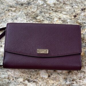 kate spade plum crossbody clutch with gold-tone plaque